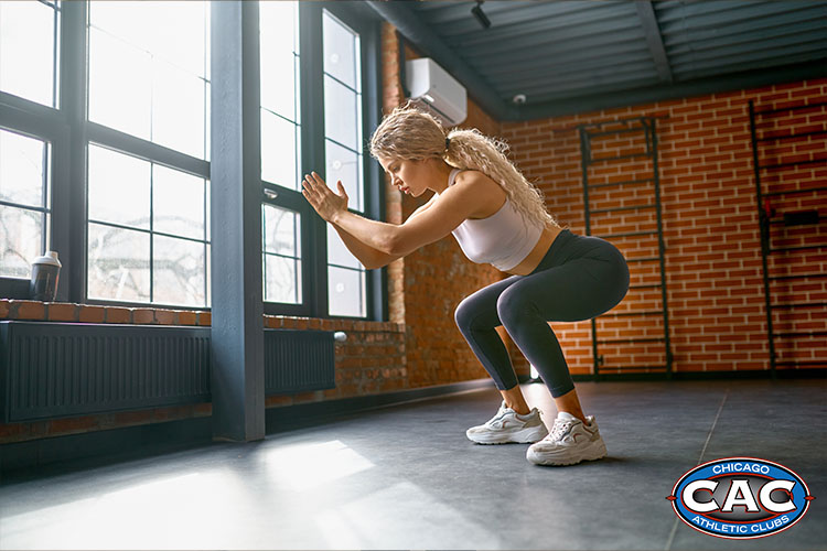 lady doing squat jumps 