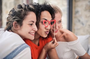 Galentine girlsfriends with heart shaped glasses hanging out
