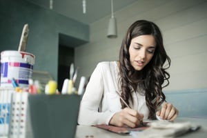 Girl painting to get her creative juices flowing