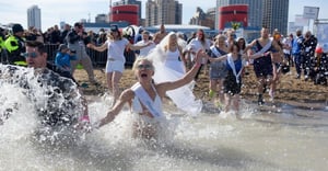 Polar Plunge bride in bikini diving in