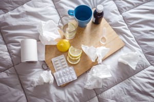 Taking care of a cold when you are sick with tissues and medicine