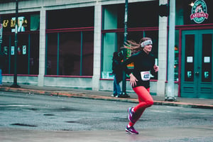 Woman running race outside