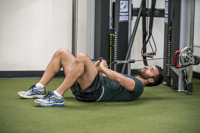 supine cable pulls for six pack in six minutes