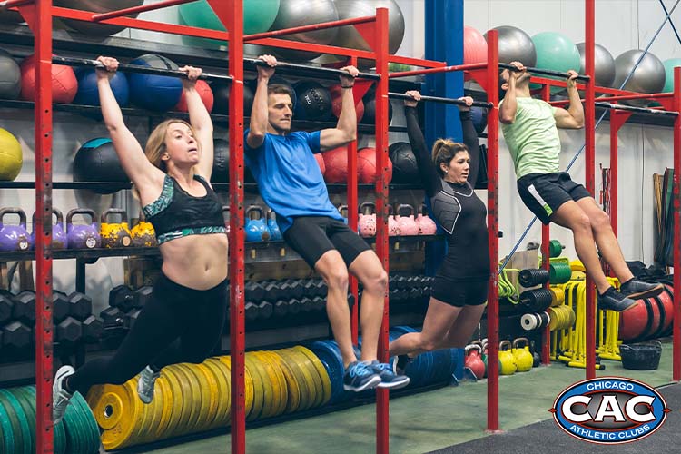 people doing pullups in gym