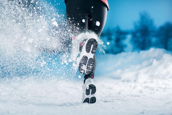 runner running in snow